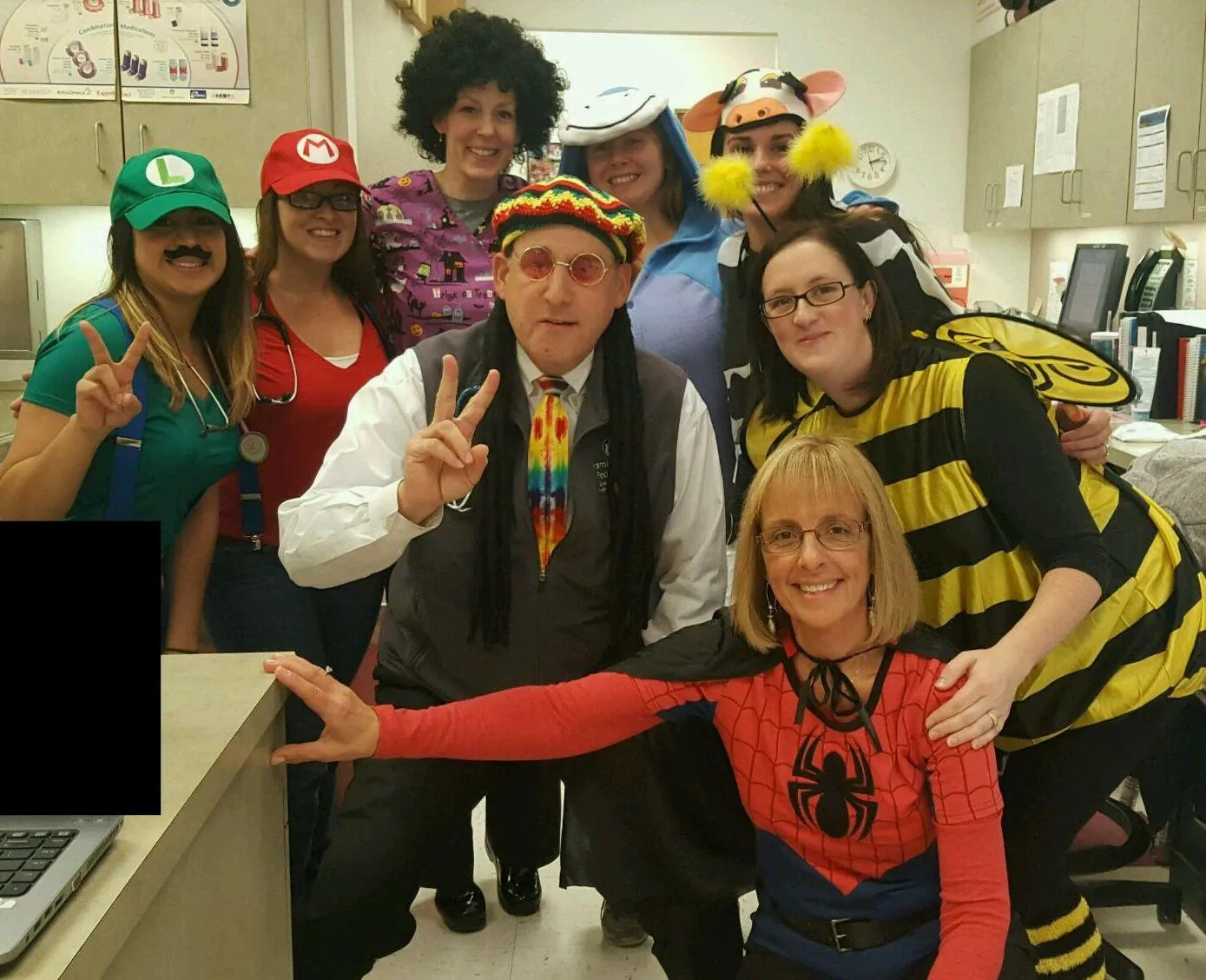 a group posing in halloween costumes