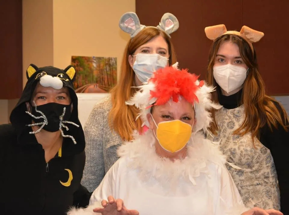 a group posing in halloween costumes