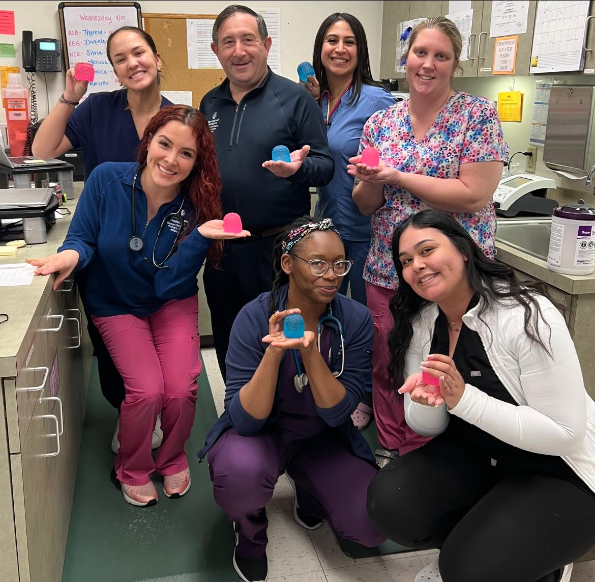 a group of medical professionals holding fidget toys