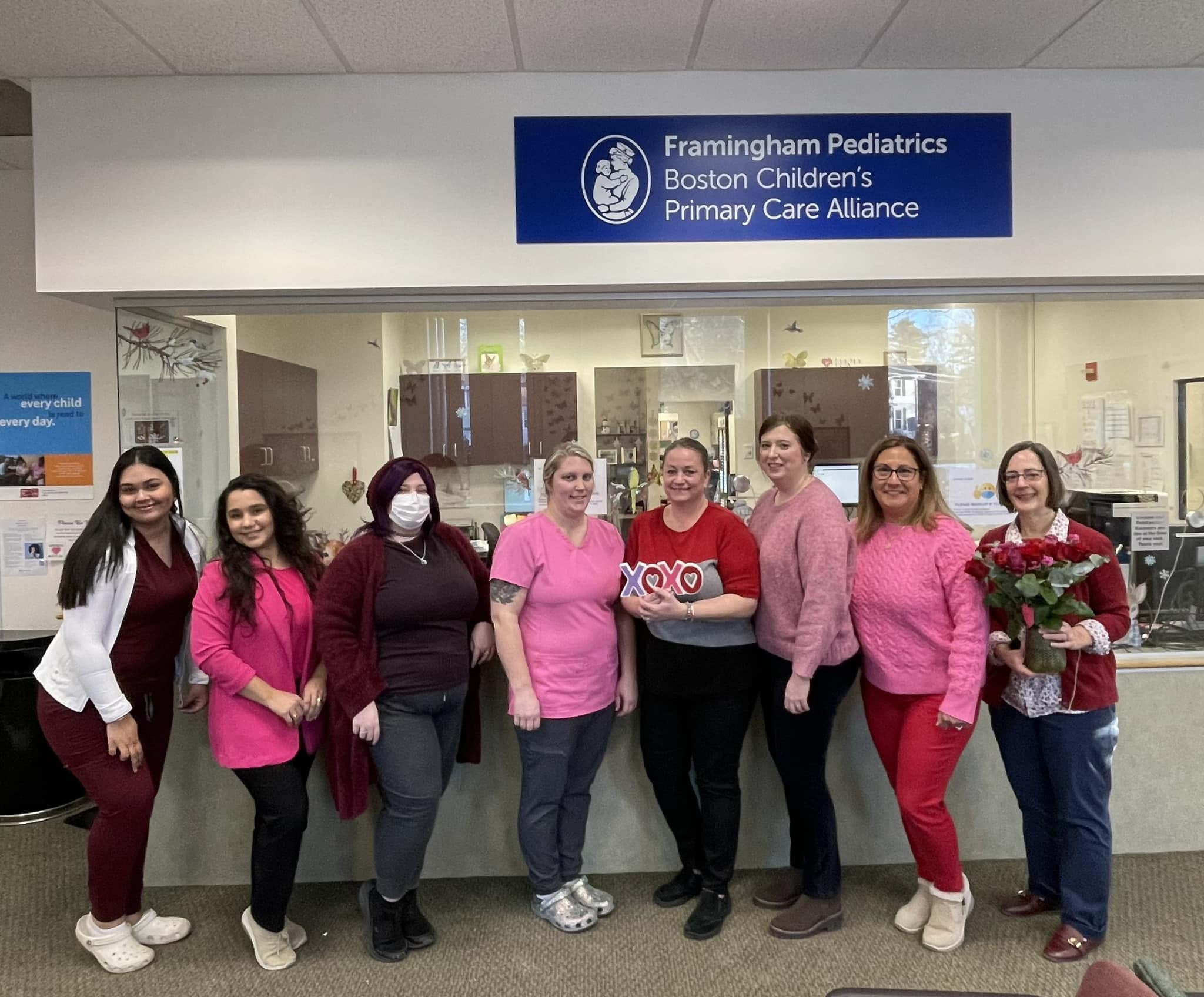 a group of medical women dressed up in pinks and reds